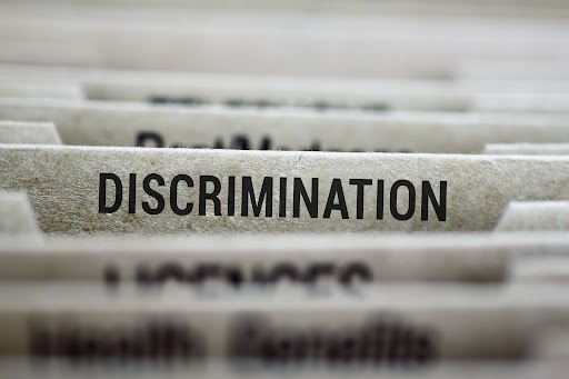 File folder tab for discrimination file with shallow DOF and focus on label File folder tab for discrimination file with shallow DOF and focus on label